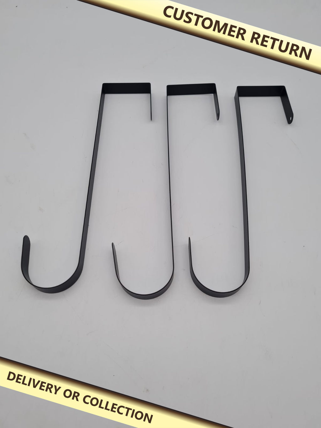 Set of 3 Over-Door Wreath Hangers — photograph 1 — Customer return; auction delivery information shown on image