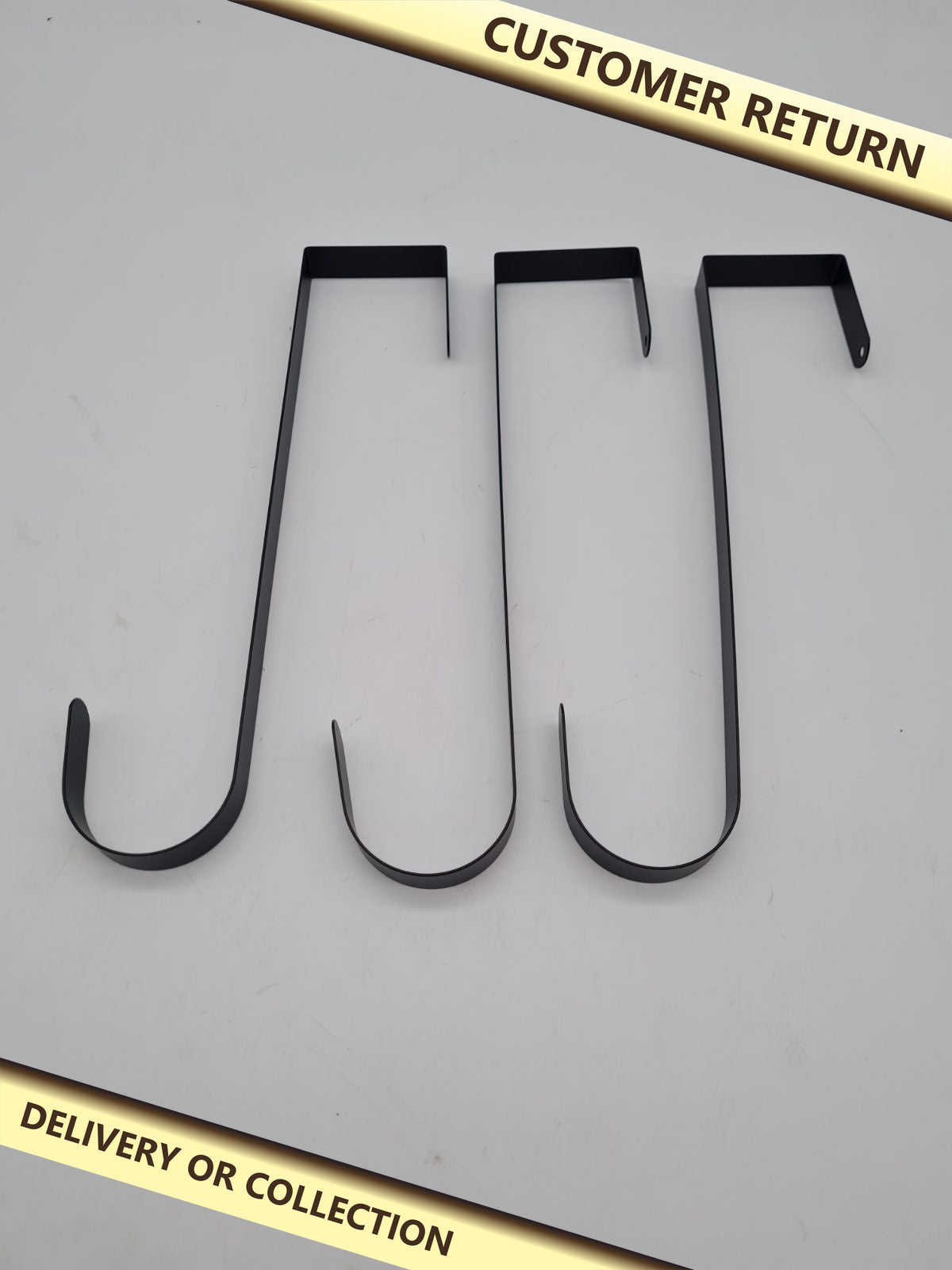 Set of 3 Over-Door Wreath Hangers — photograph 1 — Customer return; auction delivery information shown on image