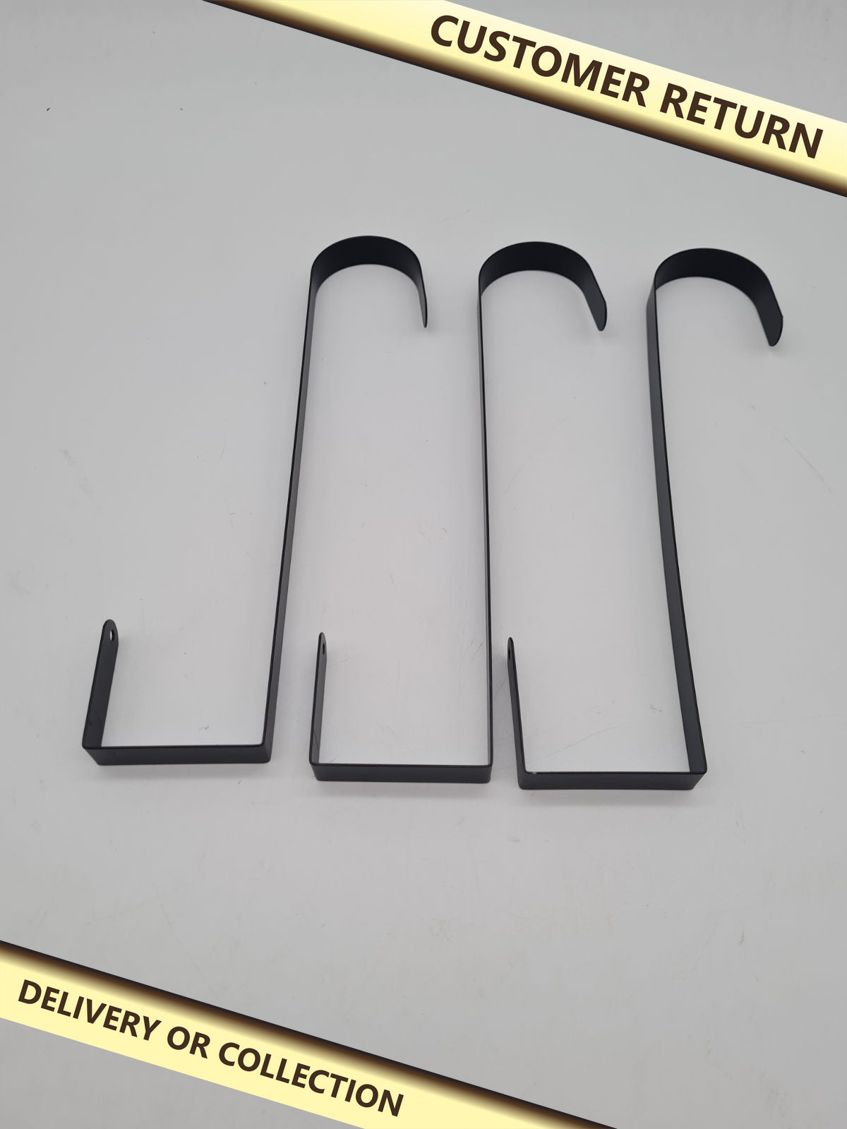 Set of 3 Over-Door Wreath Hangers — photograph 1 — Customer return; auction delivery information shown on image