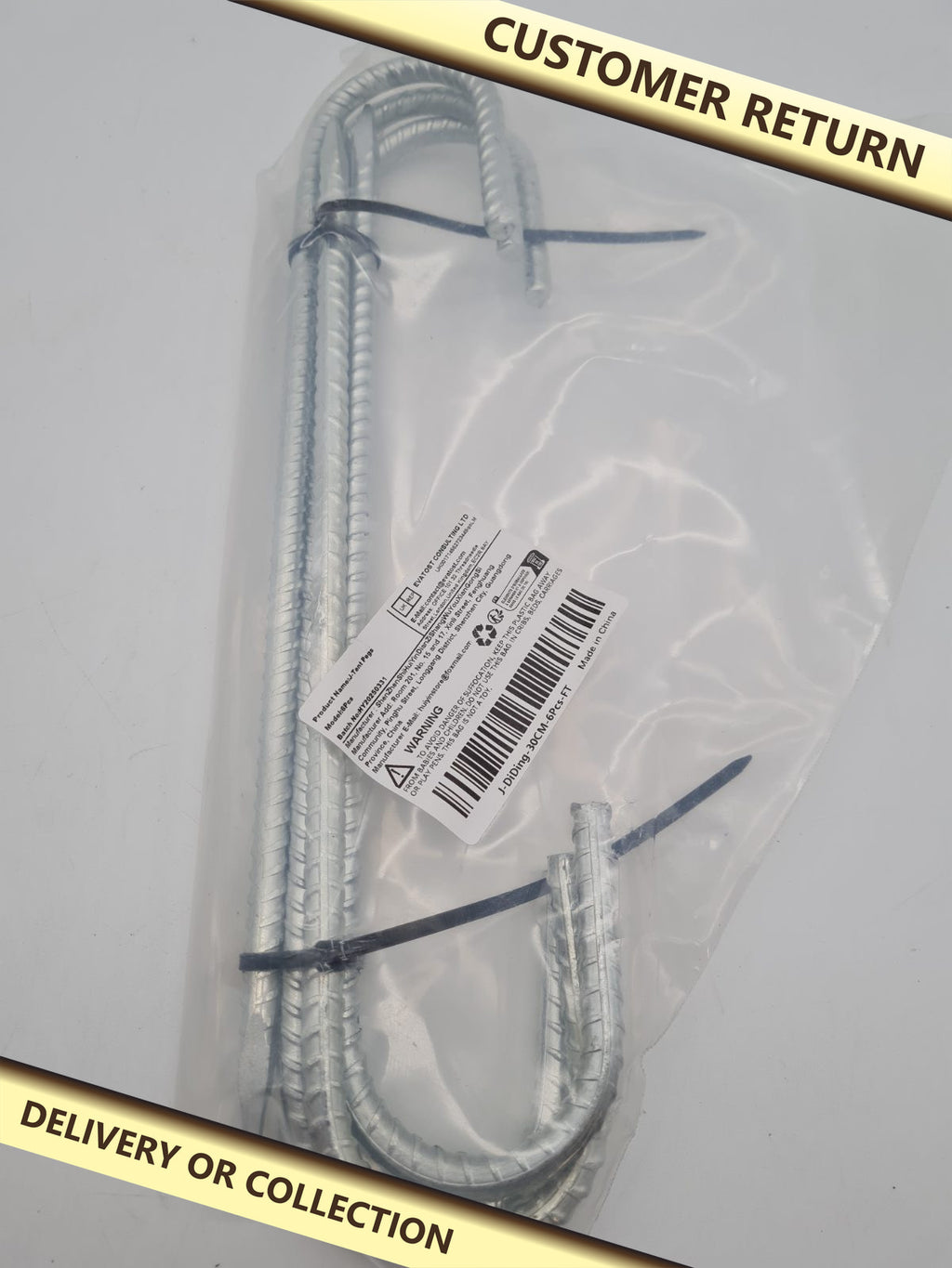 J-Shaped Metal Tent Pegs — photograph 1 — Customer return; auction delivery information shown on image