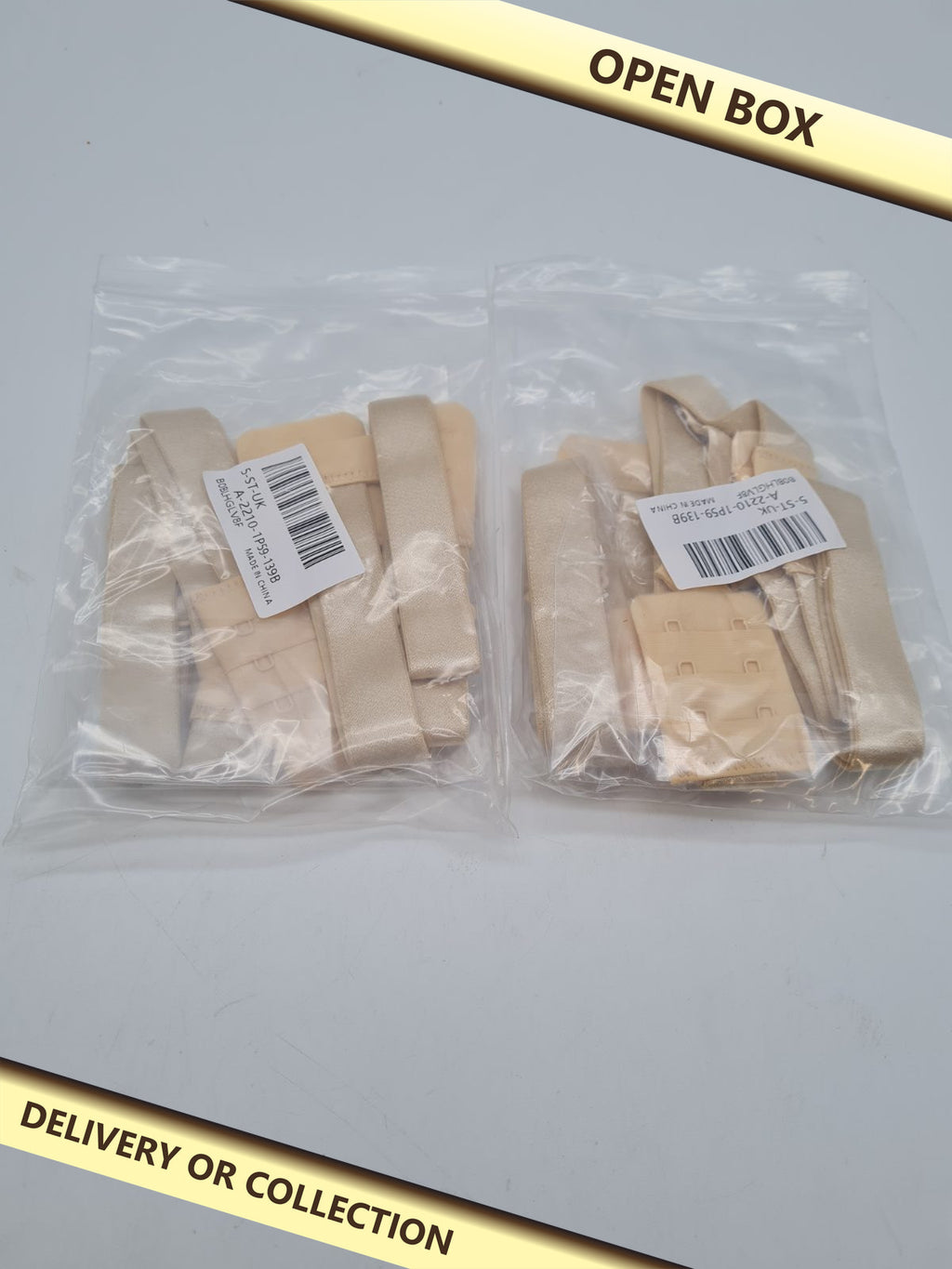 Elastic Bra Band Extenders 2 packs — photograph 1 — Open box; auction delivery information shown on image