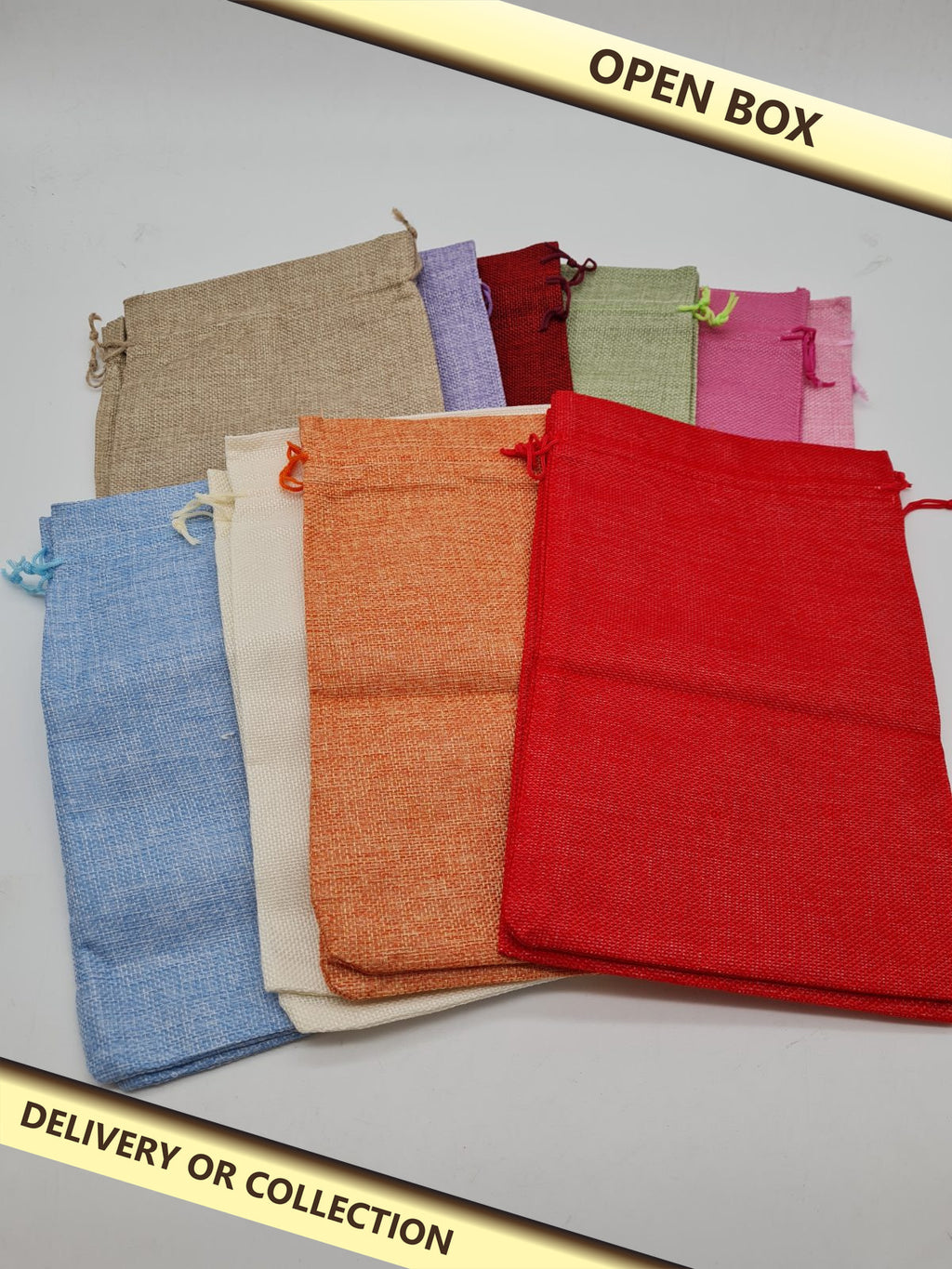 Assorted Jute-Style Drawstring Gift Bags — photograph 1 — Open box; auction delivery information shown on image