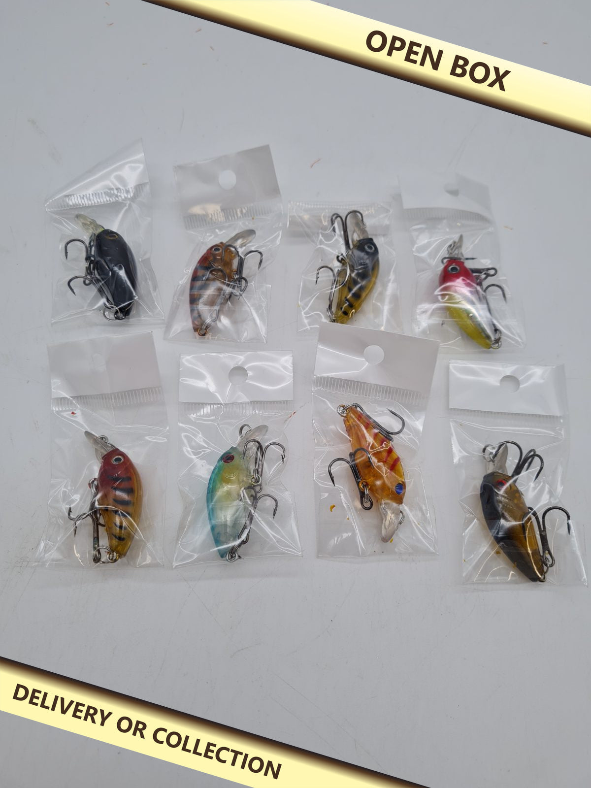 Set of 8 Fogbush Hard Fishing Lures — photograph 1 — Open box; auction delivery information shown on image