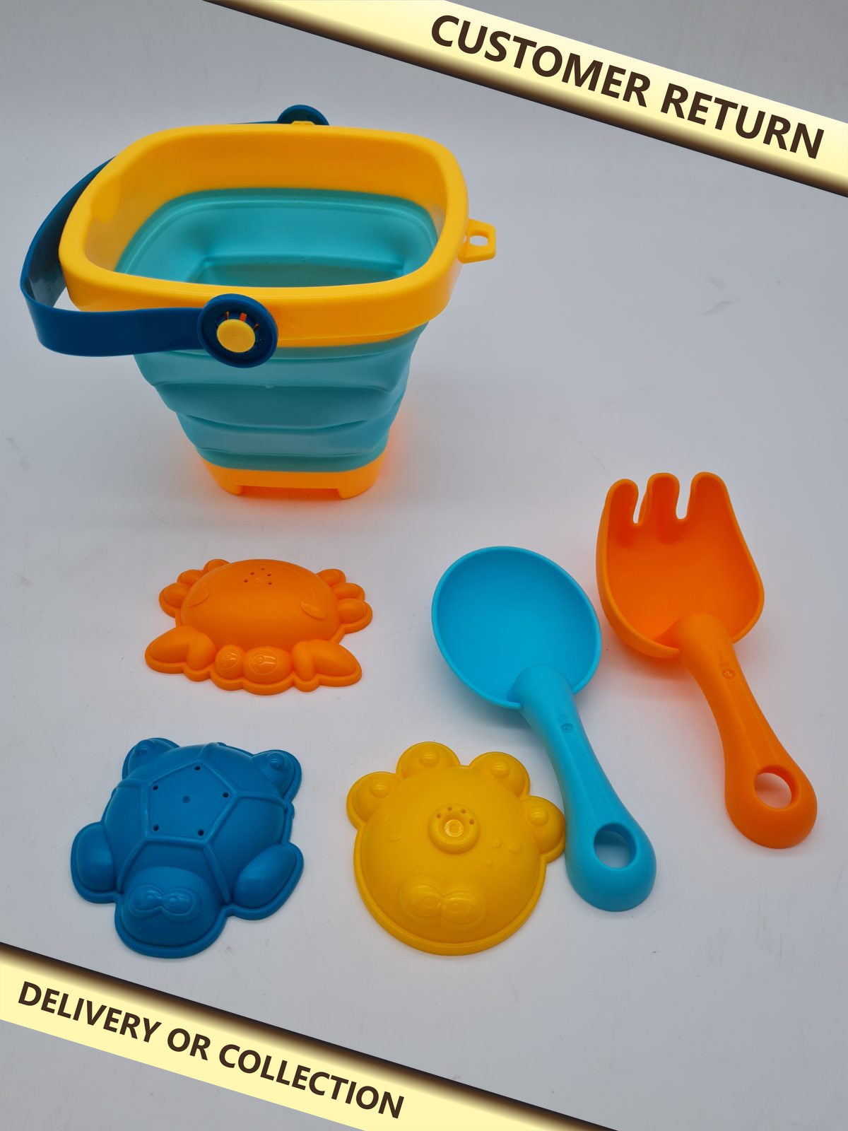 Children's collapsible bucket and sand toy set — photograph 1 — Customer return; auction delivery information shown on image