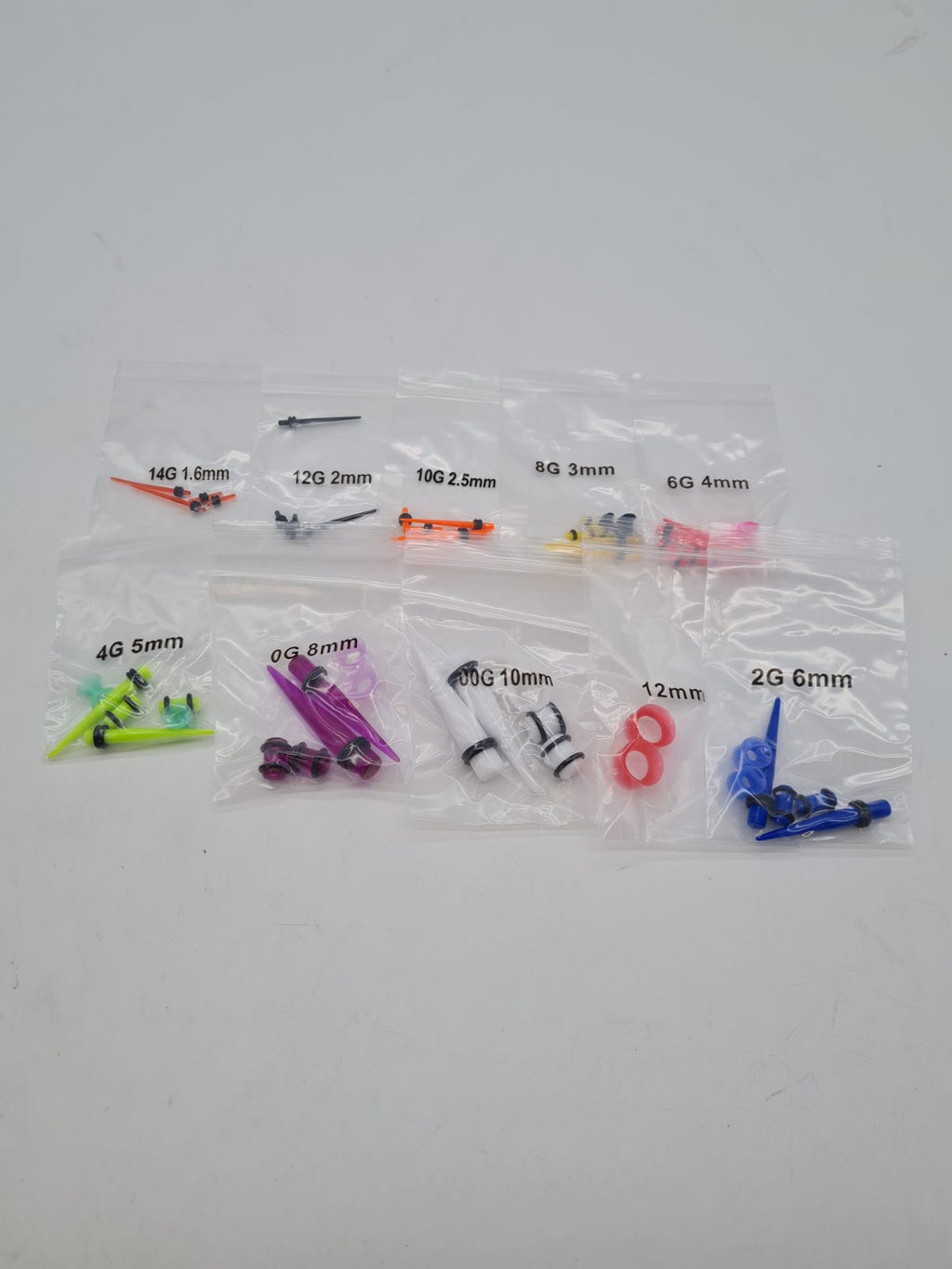 Acrylic Ear Stretching Taper and Plug Set â€” photograph 1