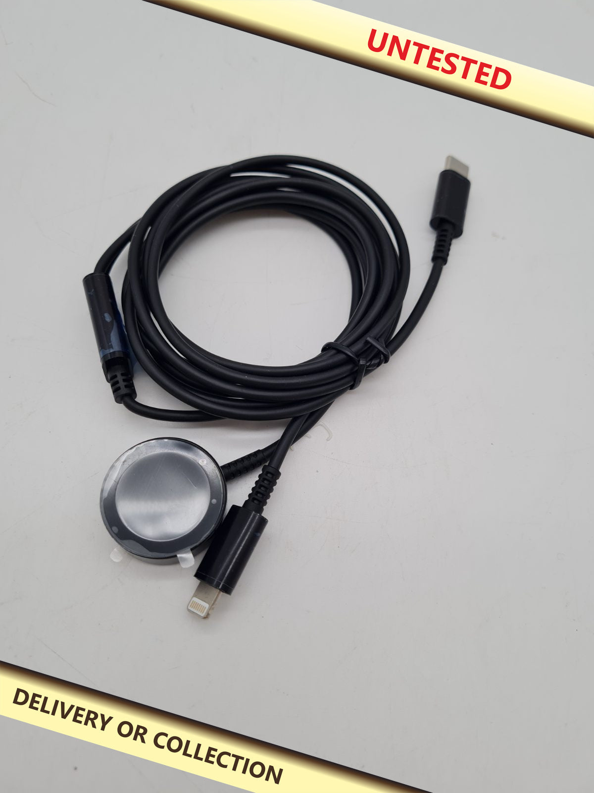 USB-C to Lightning and smartwatch charging cable — photograph 1 — Untested; auction delivery information shown on image
