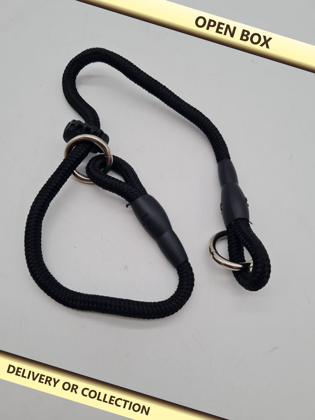 DOg traini g slip lead â€” photograph 1 — Open box; auction delivery information shown on image