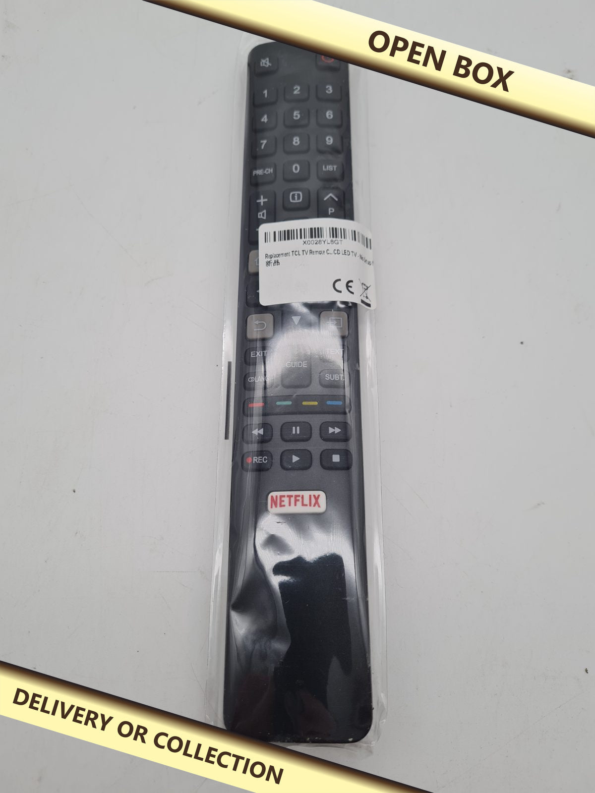 Replacement TV Remote Control — photograph 1 — Open box; auction delivery information shown on image