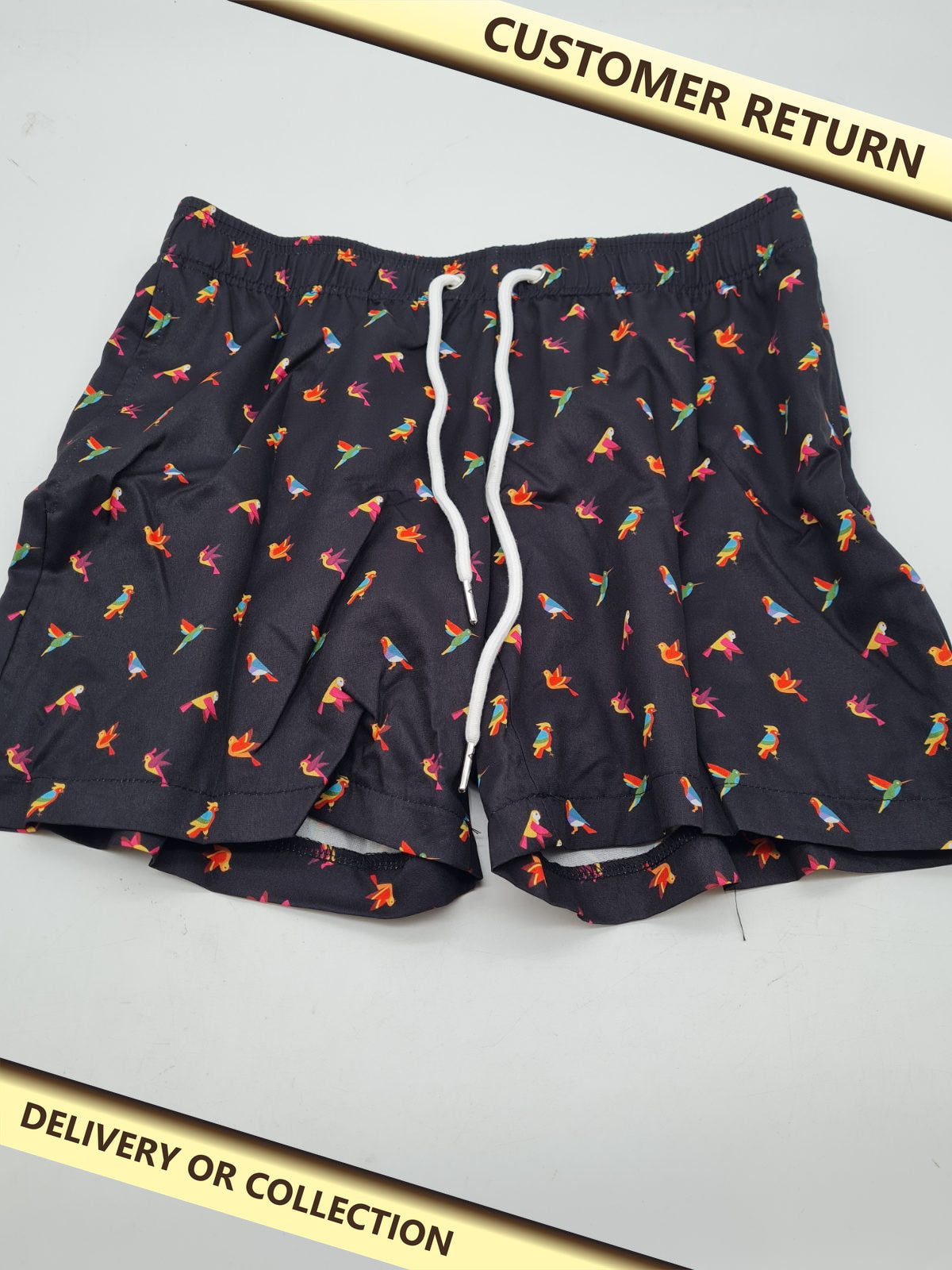Bird-print swim shorts â€” photograph 1 — Customer return; auction delivery information shown on image