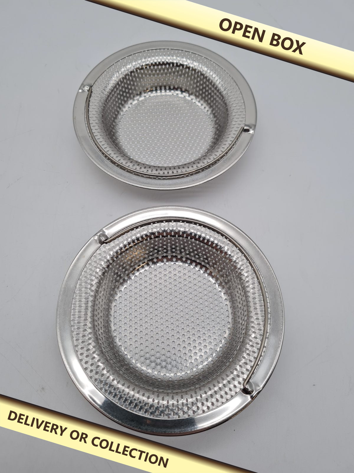 Set of 2 Sink Drain Strainers â€” photograph 1 — Open box; auction delivery information shown on image