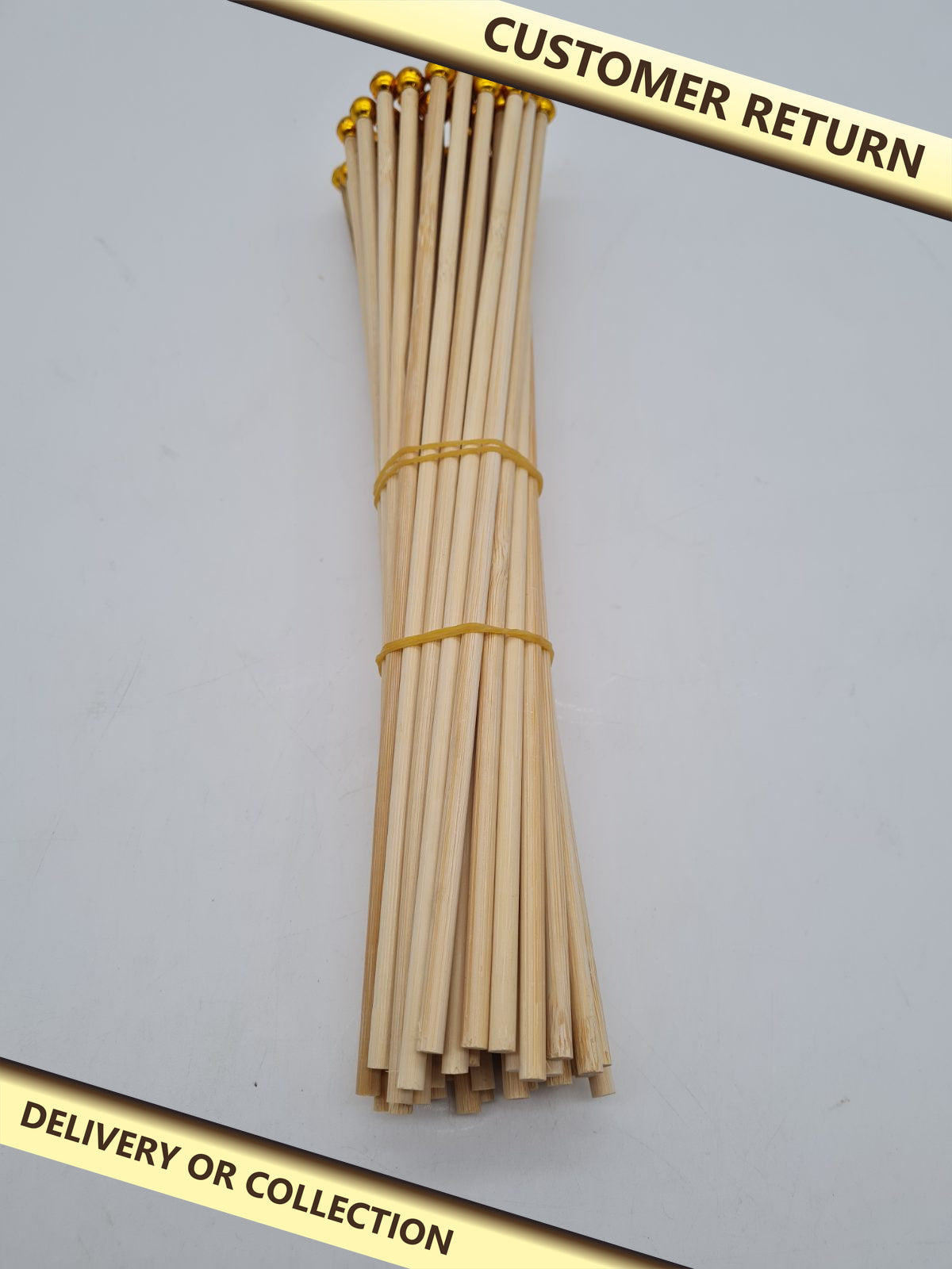 Decorative bamboo skewers with ball ends â€” photograph 1 — Customer return; auction delivery information shown on image