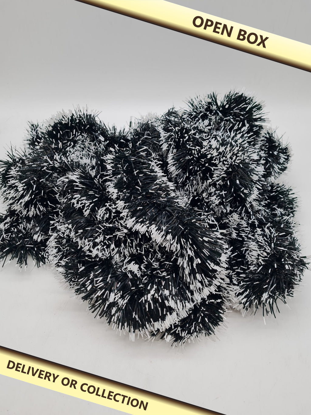 Christmas Tinsel Garland â€” photograph 1 — Open box; auction delivery information shown on image