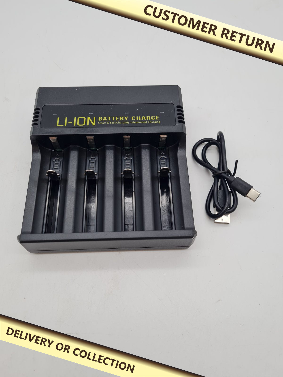 4-Slot Li-ion Battery Charger MS-5D84H â€” photograph 1 — Customer return; auction delivery information shown on image