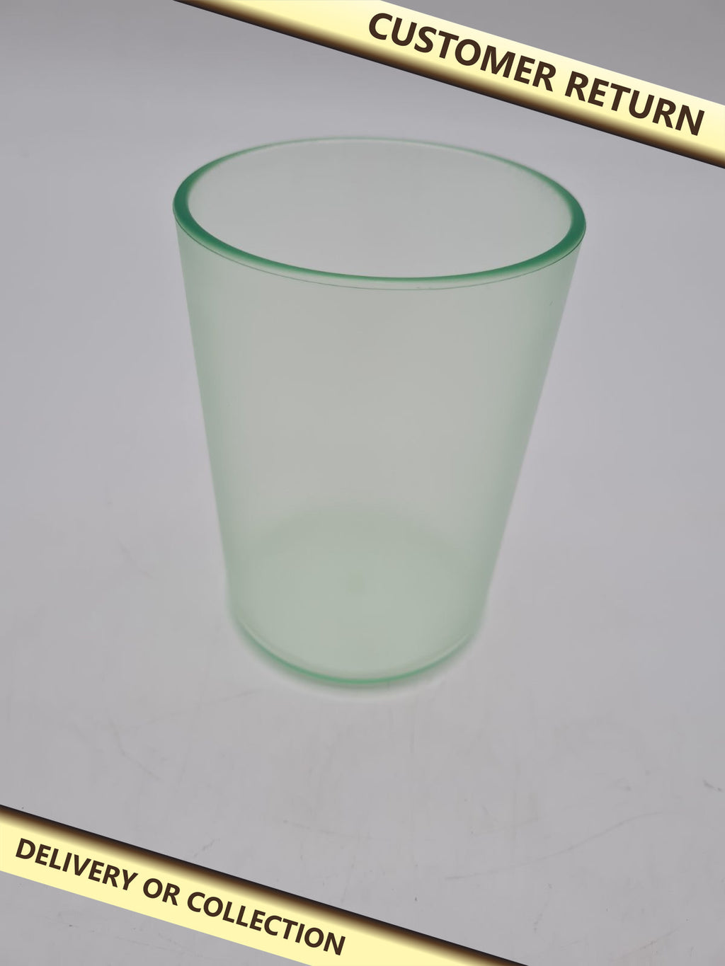 Translucent  green Toothbrush Tumbler â€” photograph 1 — Customer return; auction delivery information shown on image