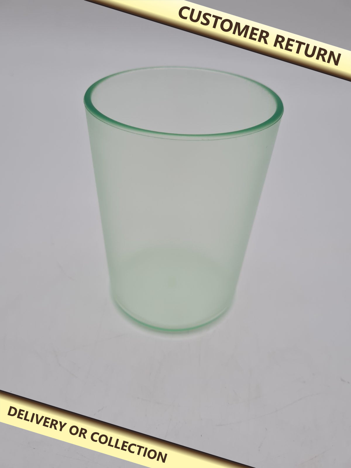 Translucent  green Toothbrush Tumbler â€” photograph 1 — Customer return; auction delivery information shown on image