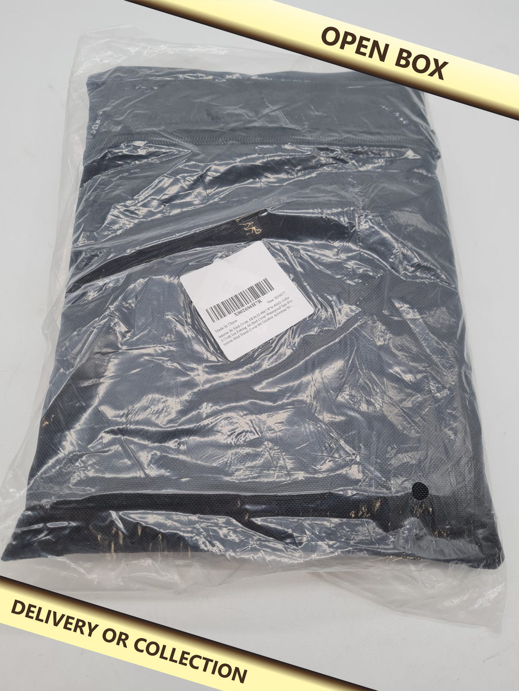 Jet sled cover 68.9 x 33 â€” photograph 1 — Open box; auction delivery information shown on image