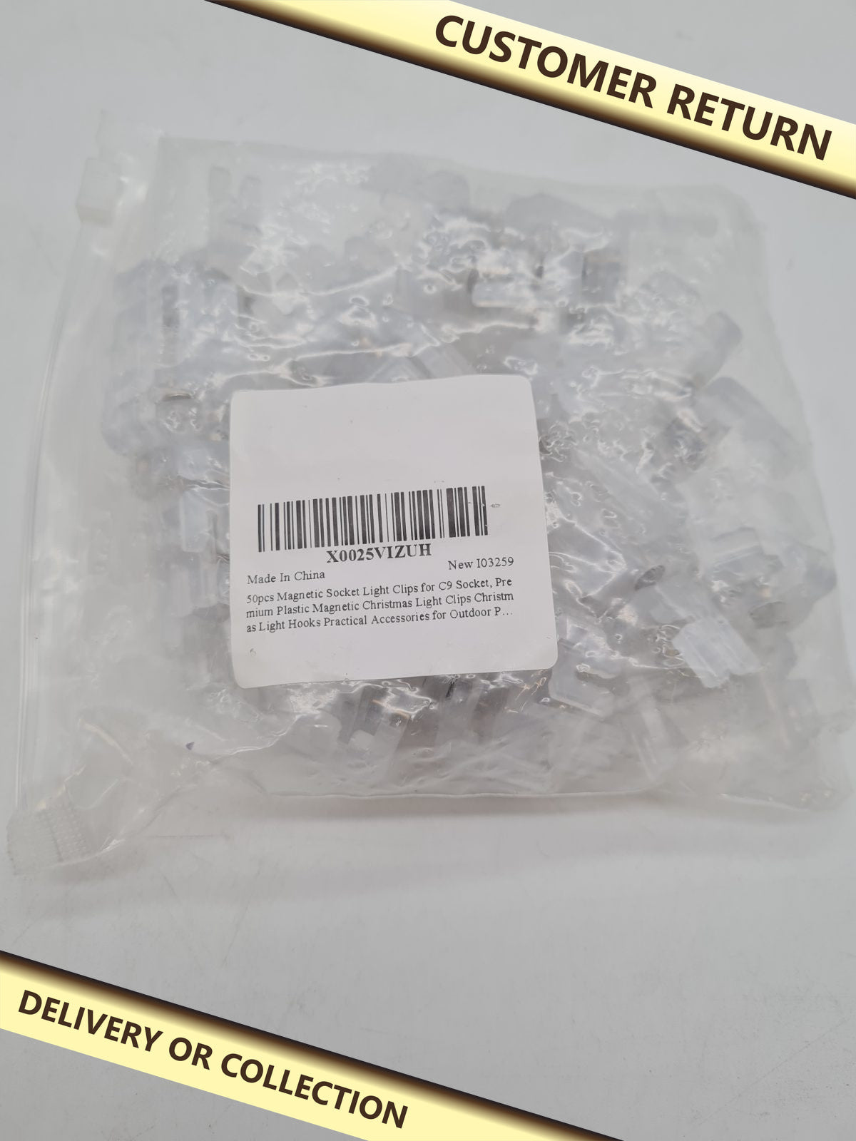 Magnetic Light Socket Clips 50pcs — photograph 1 — Customer return; auction delivery information shown on image