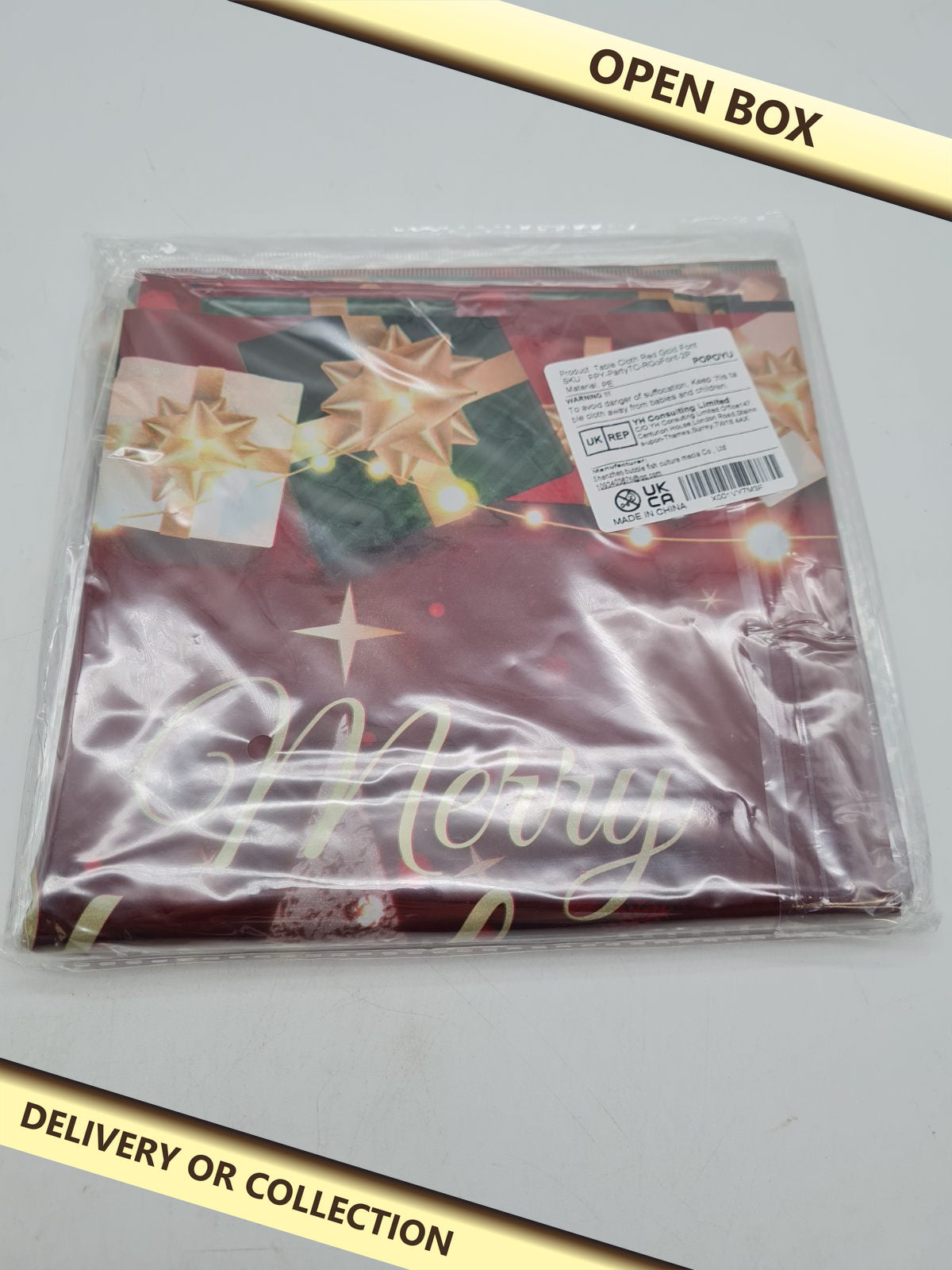 Christmas Tablecloth â€” photograph 1 — Open box; auction delivery information shown on image