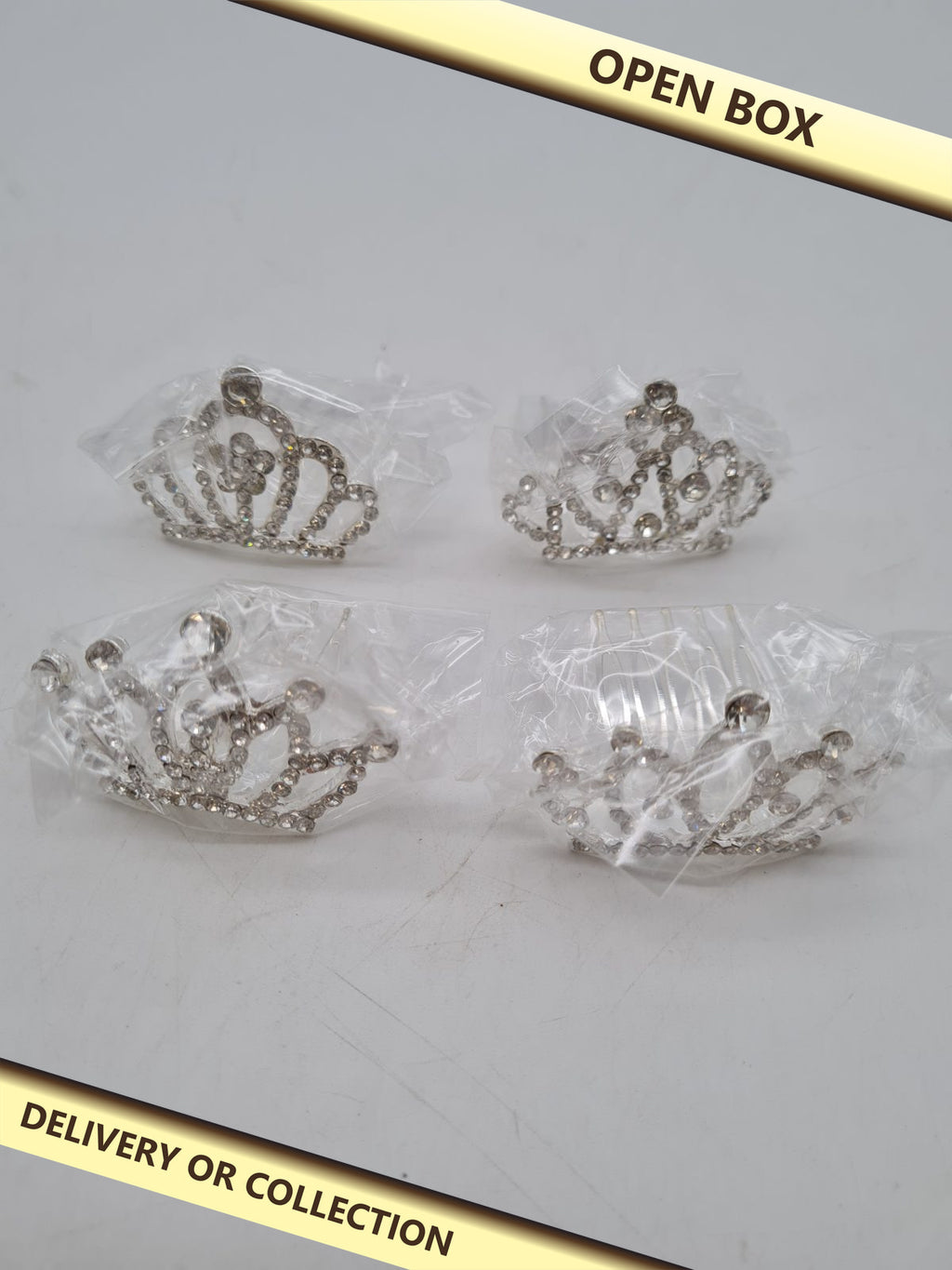 Set of 4 Mini Rhinestone Crown Hair Combs N07071 â€” photograph 1 — Open box; auction delivery information shown on image