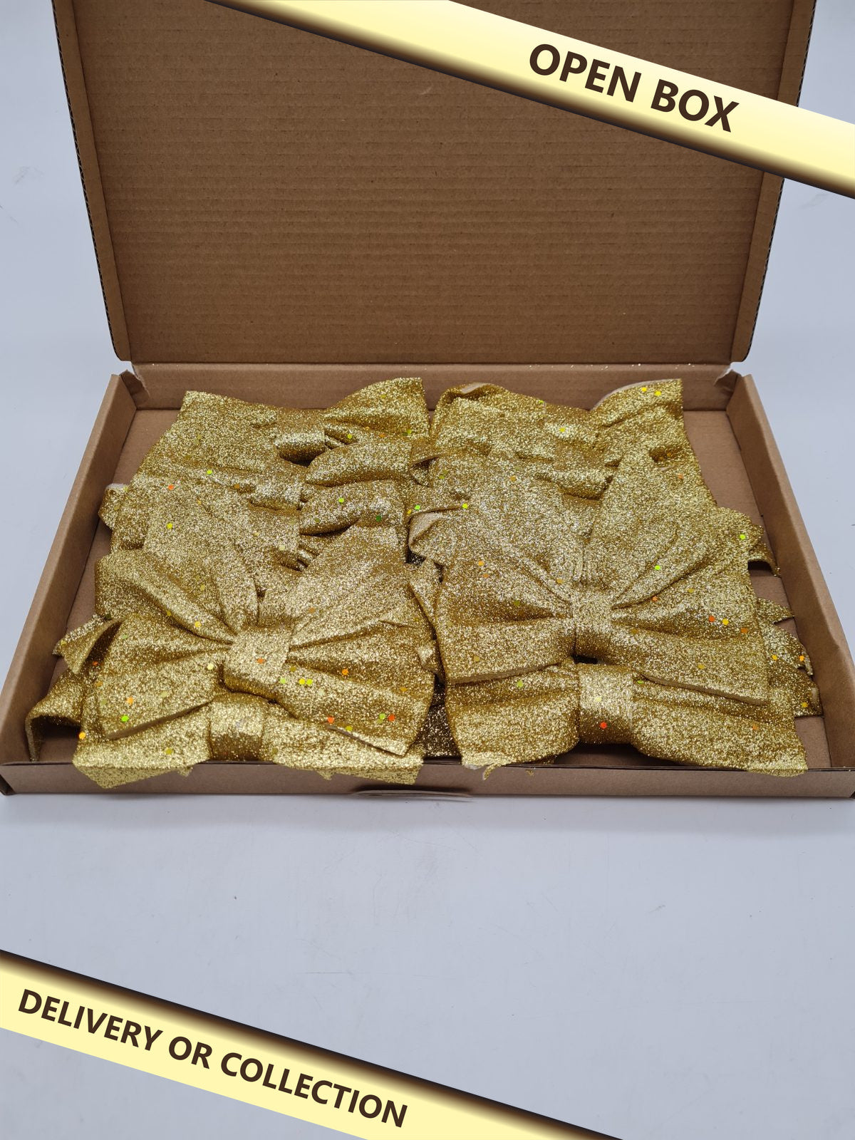 Gold Glitter Decorative Bow Set — photograph 1 — Open box; auction delivery information shown on image