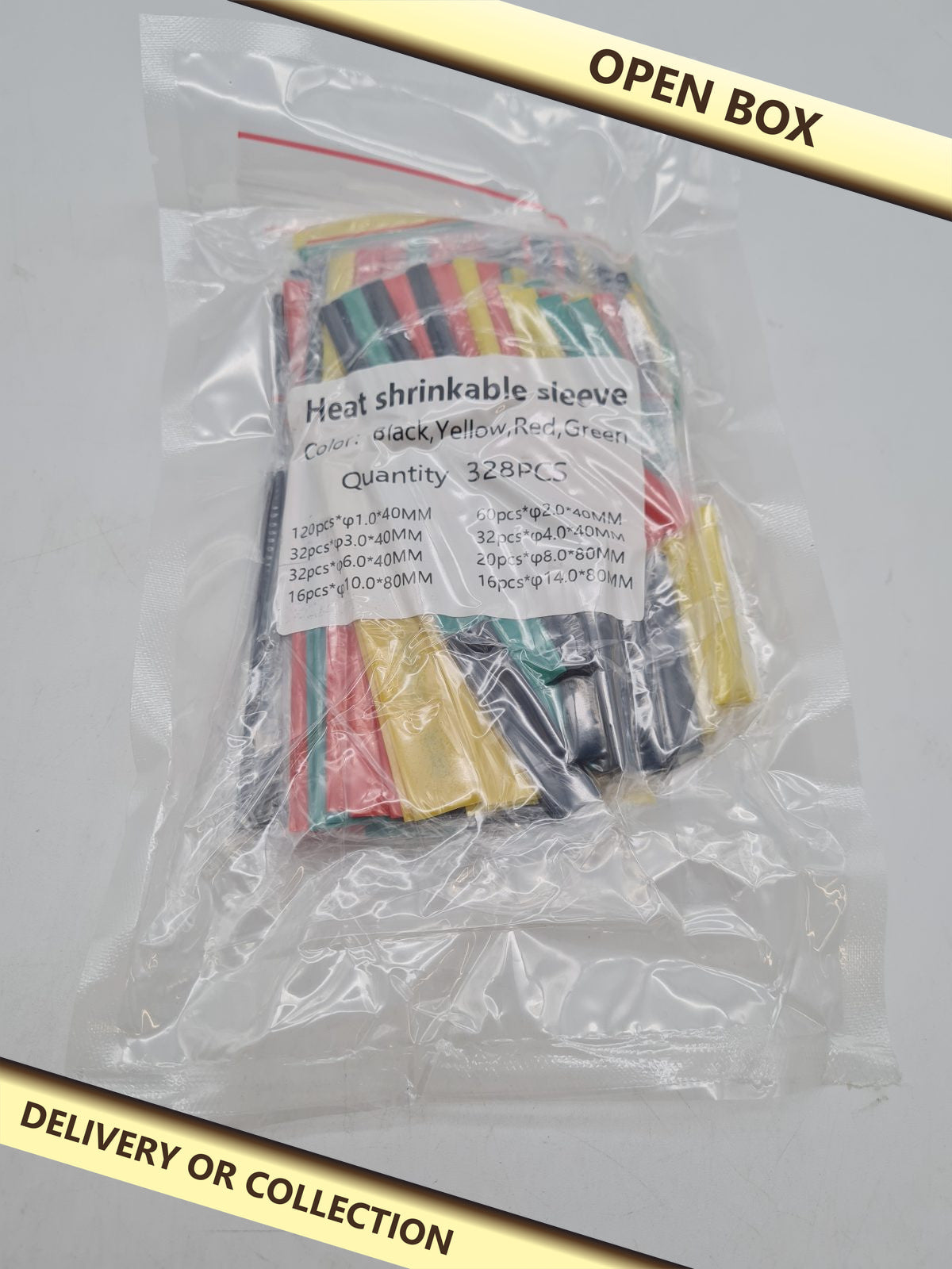Heat-Shrink Tubing Assortment, 328 Pieces â€” photograph 1 — Open box; auction delivery information shown on image