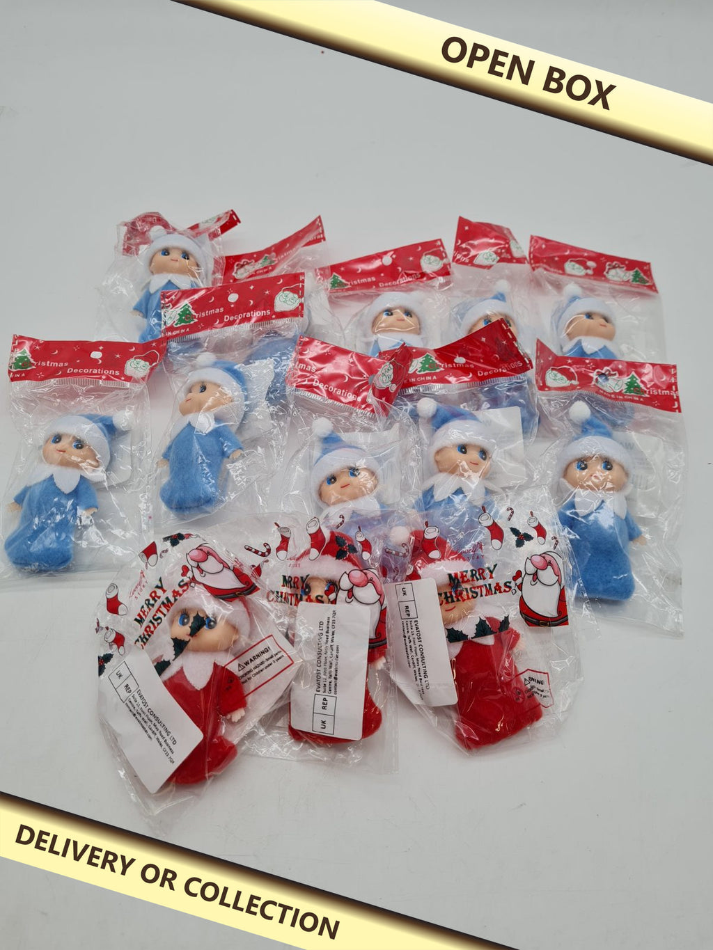 Mini doll bundle â€” photograph 1 — Open box; auction delivery information shown on image