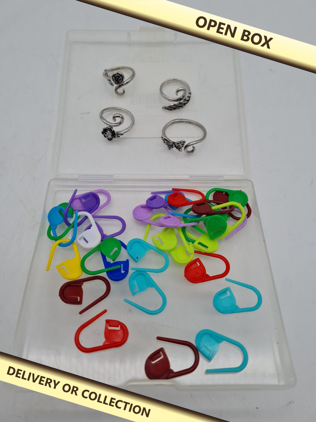 Crochet Tension Ring and Stitch Marker Set â€” photograph 1 — Open box; auction delivery information shown on image