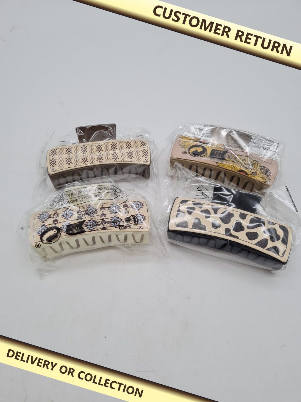 Set of 4 Patterned Hair Claw Clips â€” photograph 1 — Customer return; auction delivery information shown on image