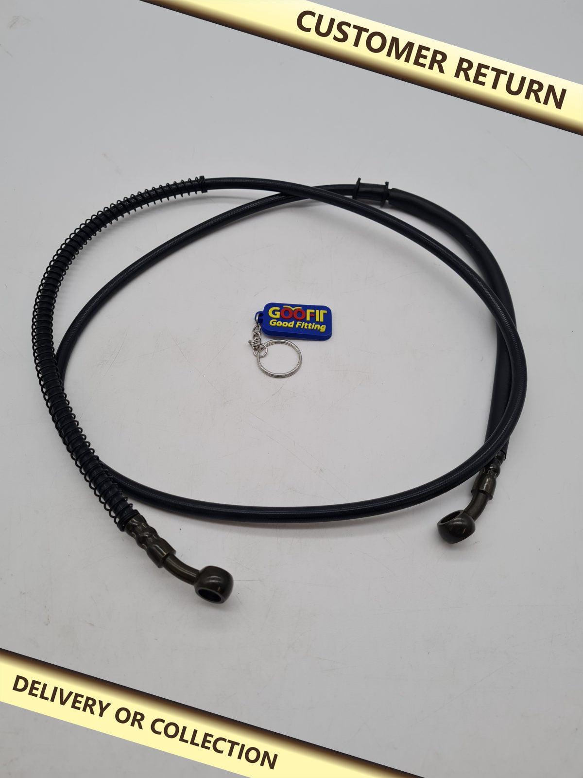 Braided motorcycle brake hose assembly — photograph 1 — Customer return; auction delivery information shown on image