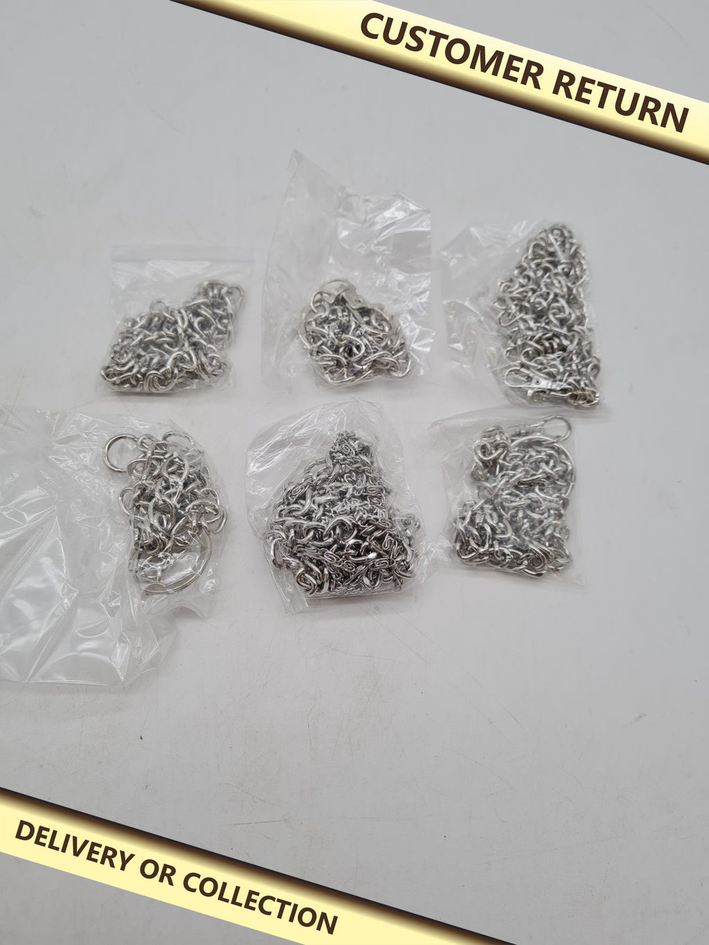 Set of 6 Metal Accessory Chains with Lobster Clasps — photograph 1 — Customer return; auction delivery information shown on image