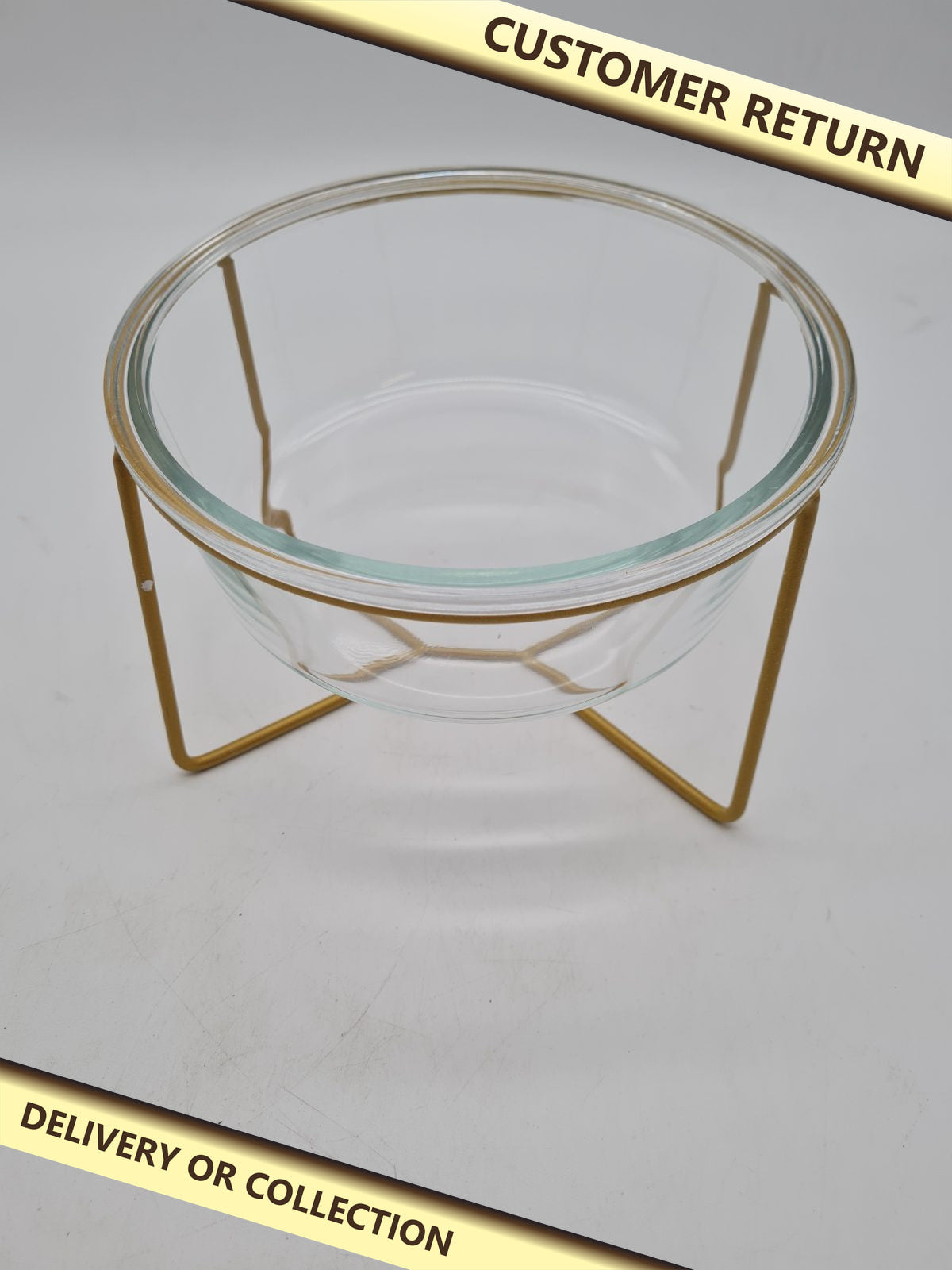 Glass pet feeding bowl with raised metal stand — photograph 1 — Customer return; auction delivery information shown on image