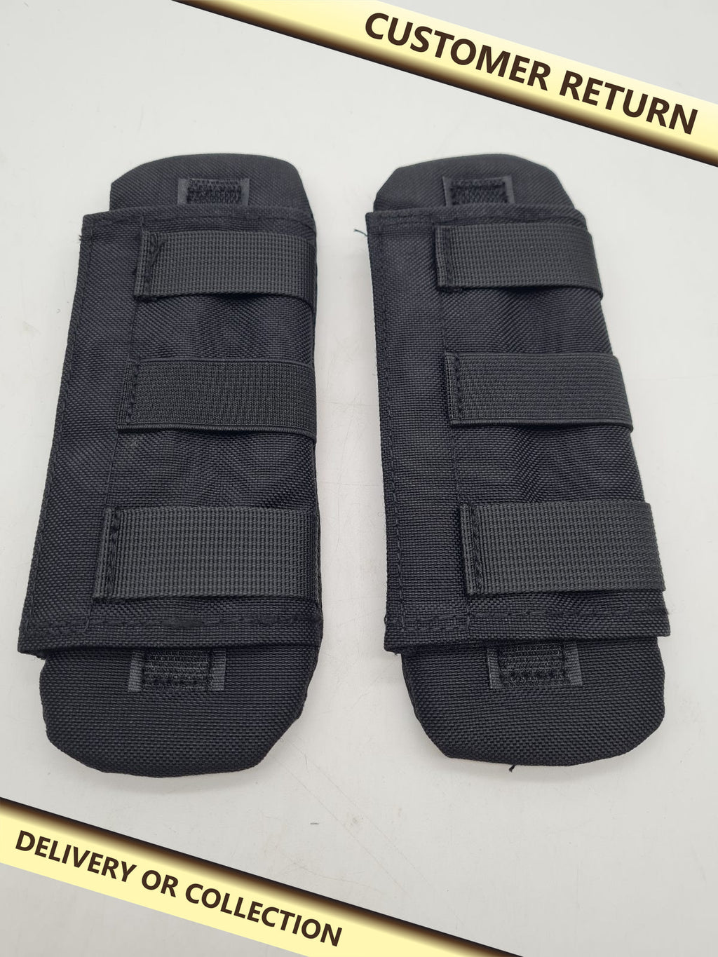 Pair of shoulder strap pads â€” photograph 1 — Customer return; auction delivery information shown on image