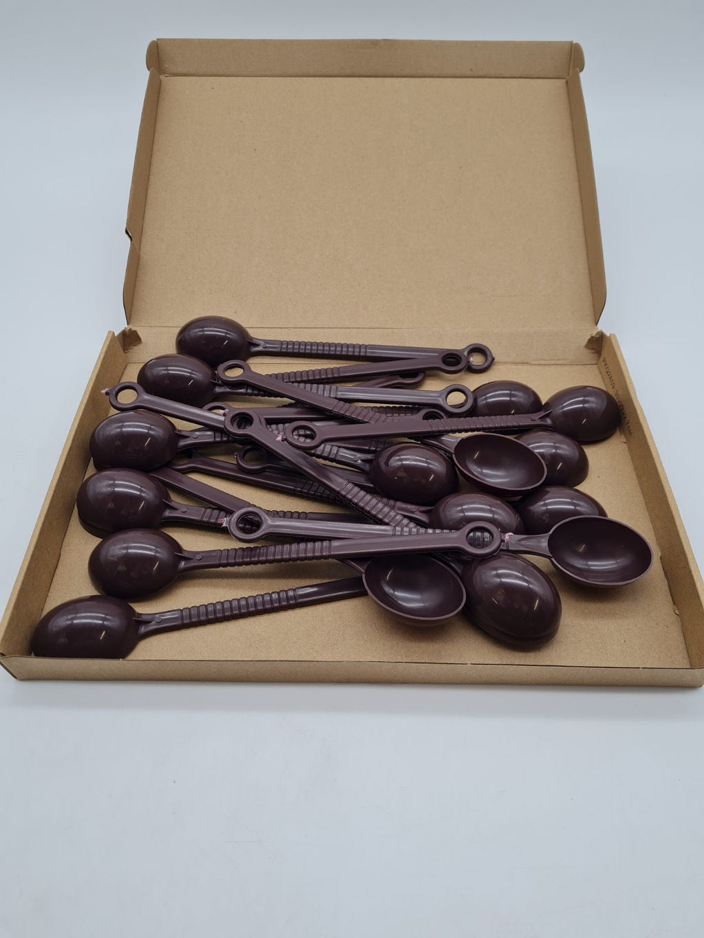 Long-handled plastic scoops with hanging loops — photograph 2