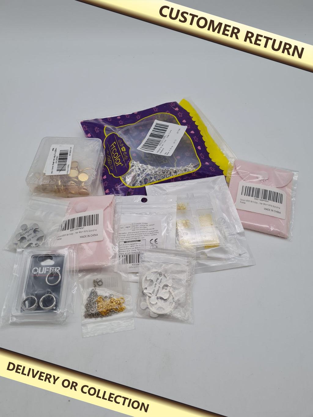Jewellery accessories bundle â€” photograph 1 — Customer return; auction delivery information shown on image
