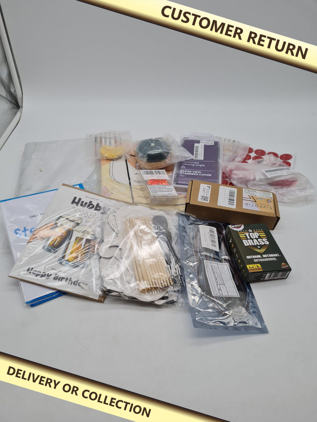 Random bundle of items â€” photograph 1 — Customer return; auction delivery information shown on image