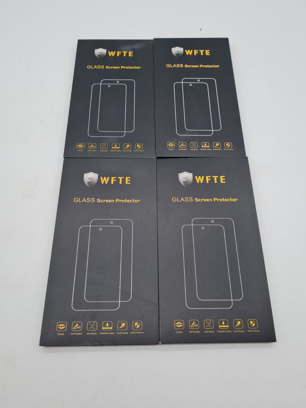 Bundle of 4 WFTE Glass Smartphone Screen Protectors â€” photograph 1