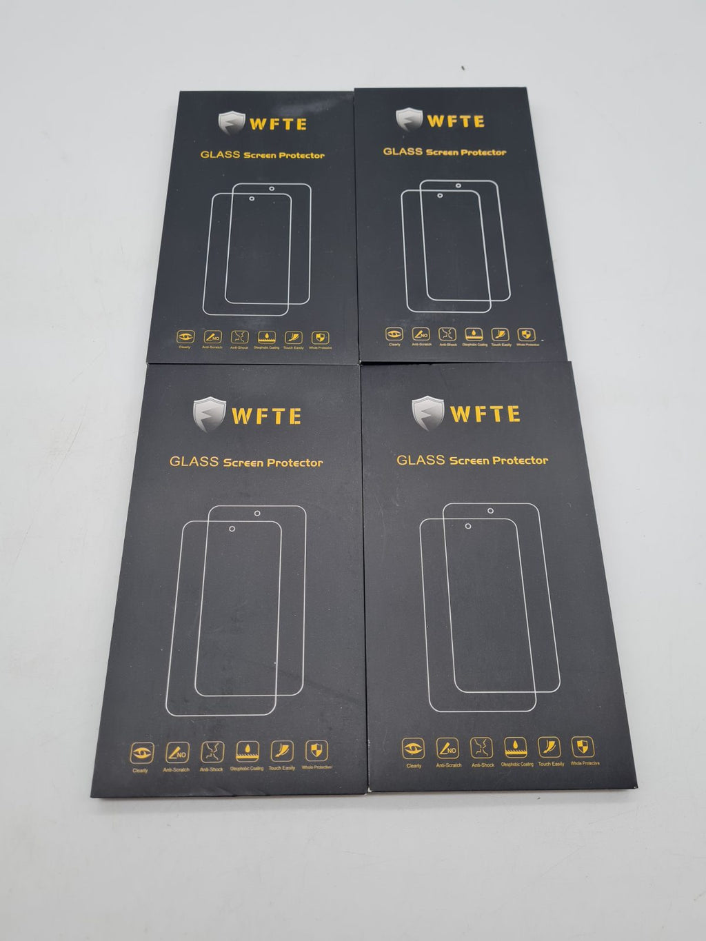Bundle of 4 WFTE Glass Smartphone Screen Protectors â€” photograph 1