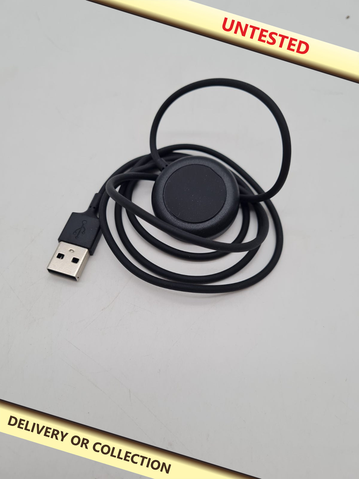 USB-A Smartwatch Charging Cable â€” photograph 1 — Untested; auction delivery information shown on image