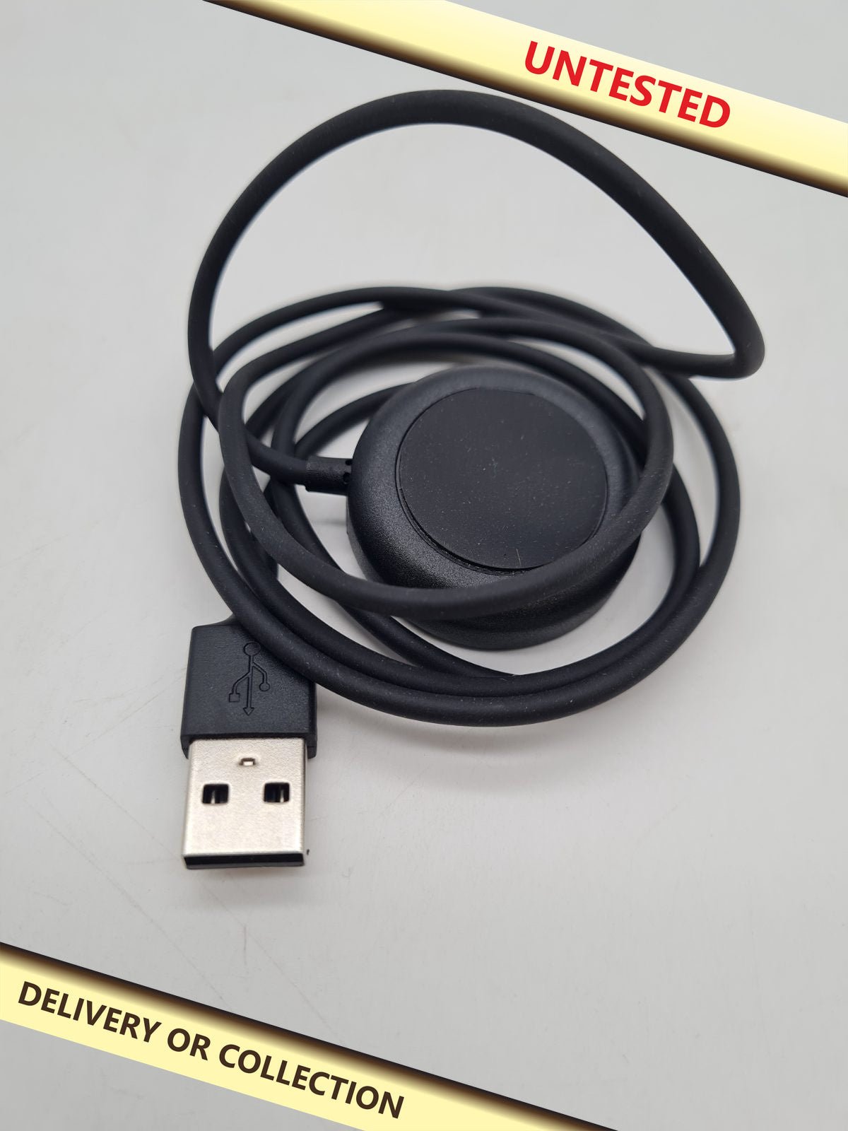 USB-A Smartwatch Charging Cable â€” photograph 1 — Untested; auction delivery information shown on image