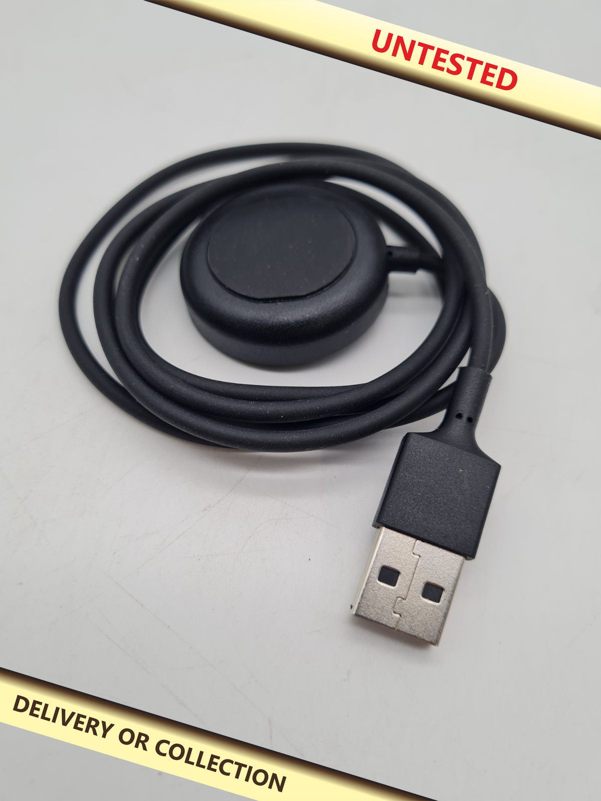 USB-A Smartwatch Charging Cable â€” photograph 1 — Untested; auction delivery information shown on image