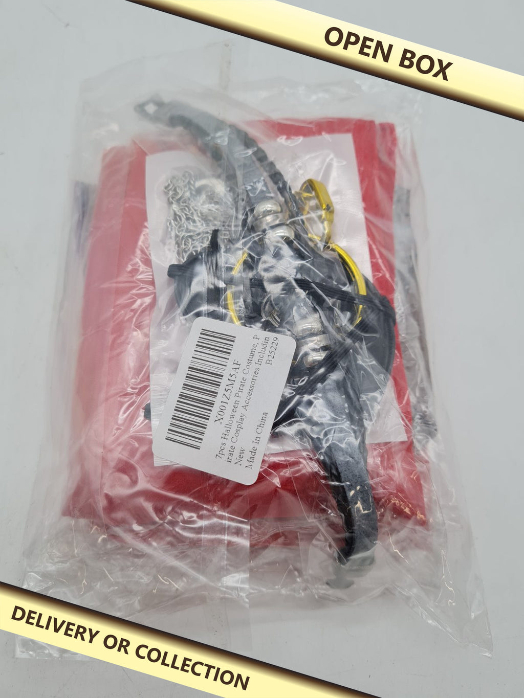 Pirate Fancy Dress Costume and Accessory Set â€” photograph 1 — Open box; auction delivery information shown on image
