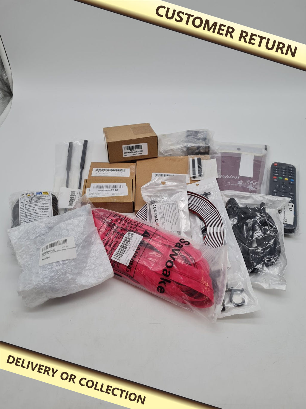 Mixed bundle of randomness — photograph 1 — Customer return; auction delivery information shown on image