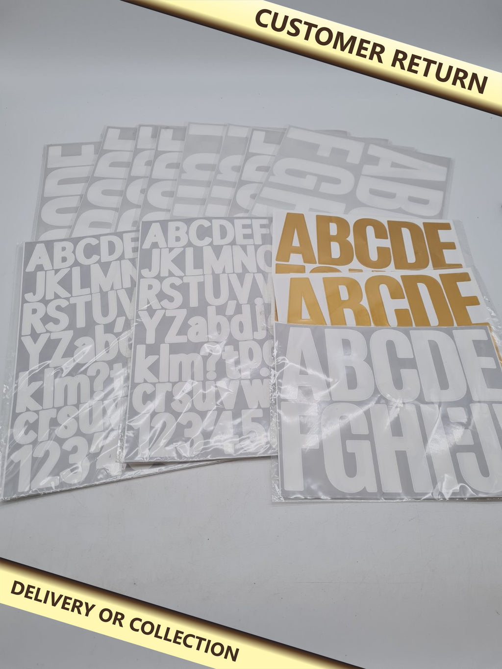 Bundle of Assortment of letter stickers — photograph 1 — Customer return; auction delivery information shown on image