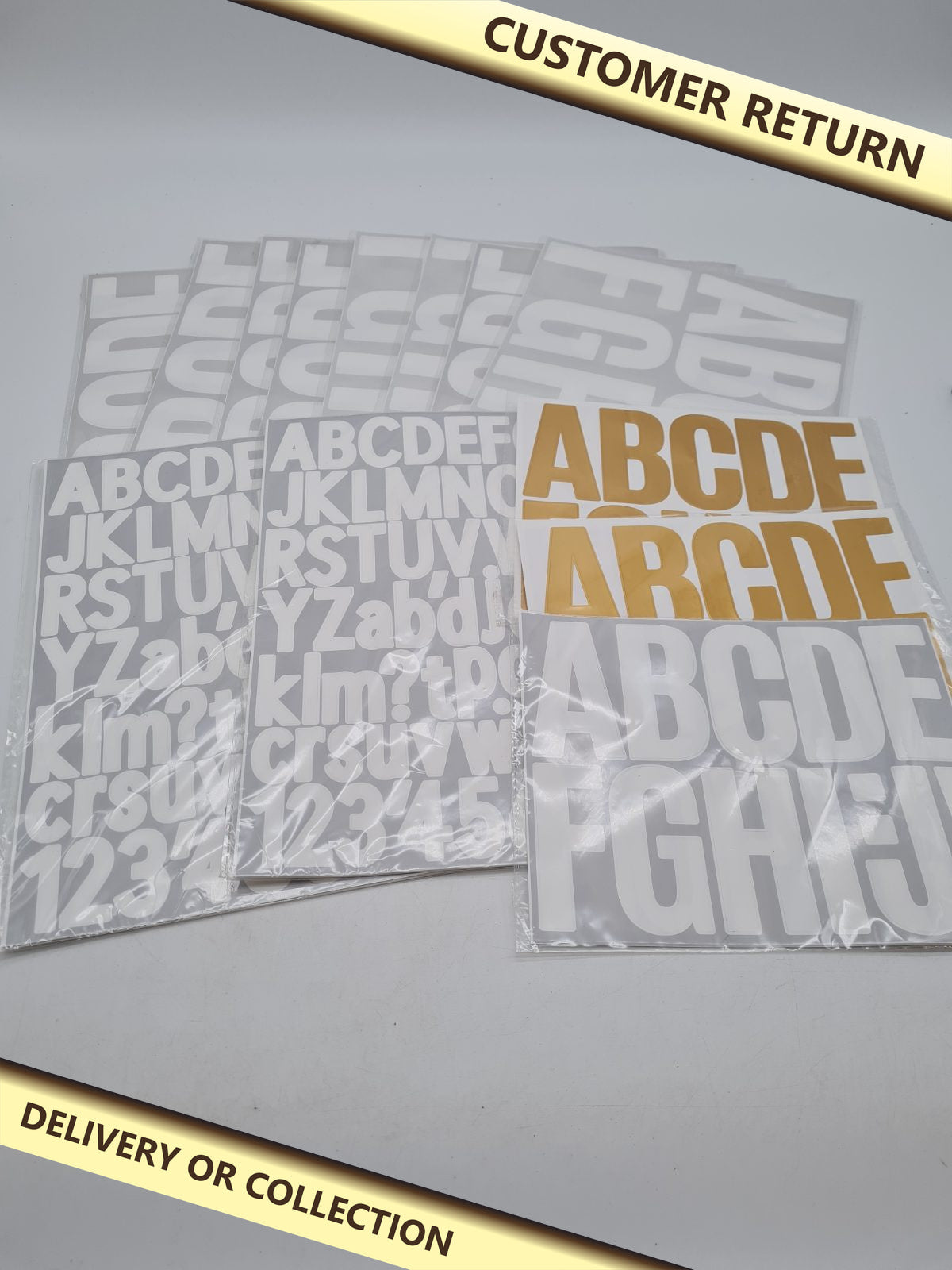 Bundle of Assortment of letter stickers — photograph 1 — Customer return; auction delivery information shown on image