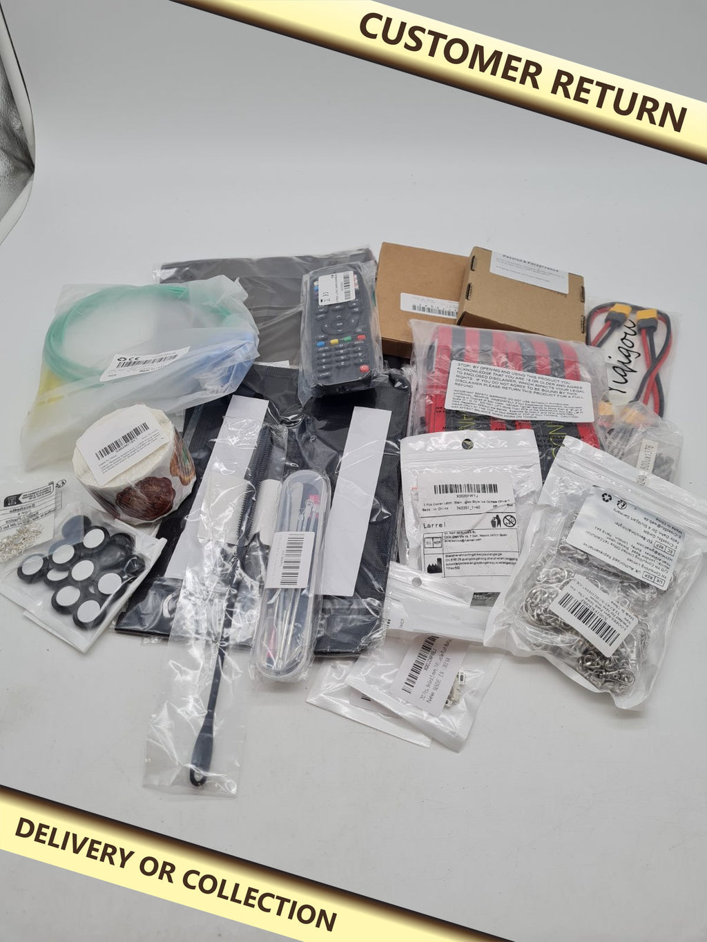 Bundle mix of different products â€” photograph 1 — Customer return; auction delivery information shown on image