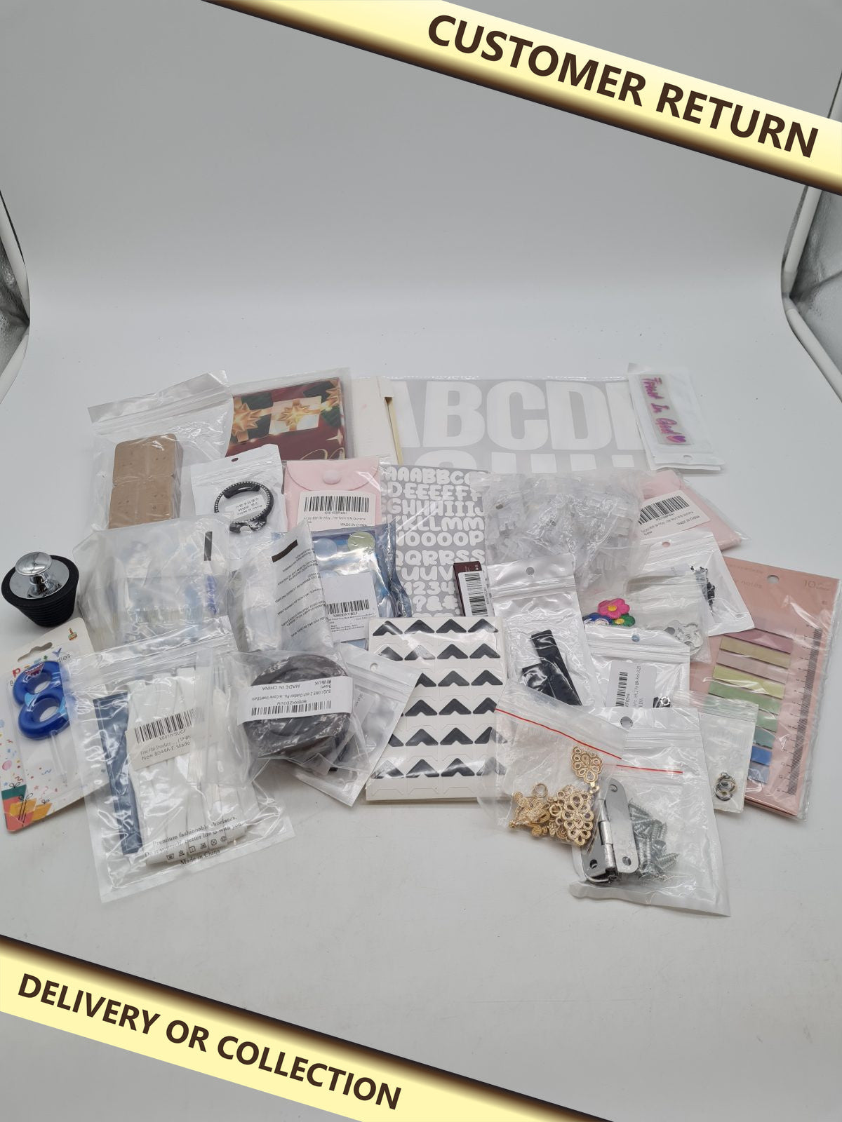 Mixed bundle of products â€” photograph 1 — Customer return; auction delivery information shown on image