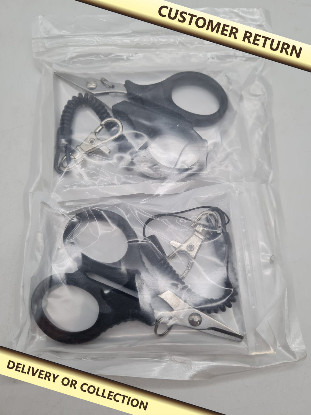 2-Piece Fishing Scissors Set with Retractable Clips â€” photograph 1 — Customer return; auction delivery information shown on image