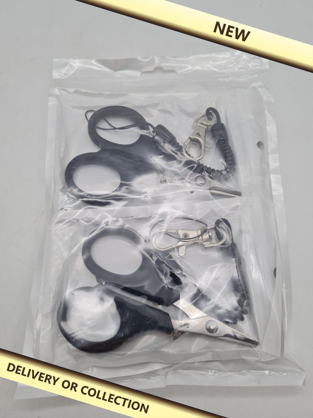 2-Piece Fishing Scissors Set with Retractable Clips â€” photograph 1 — New; auction delivery information shown on image