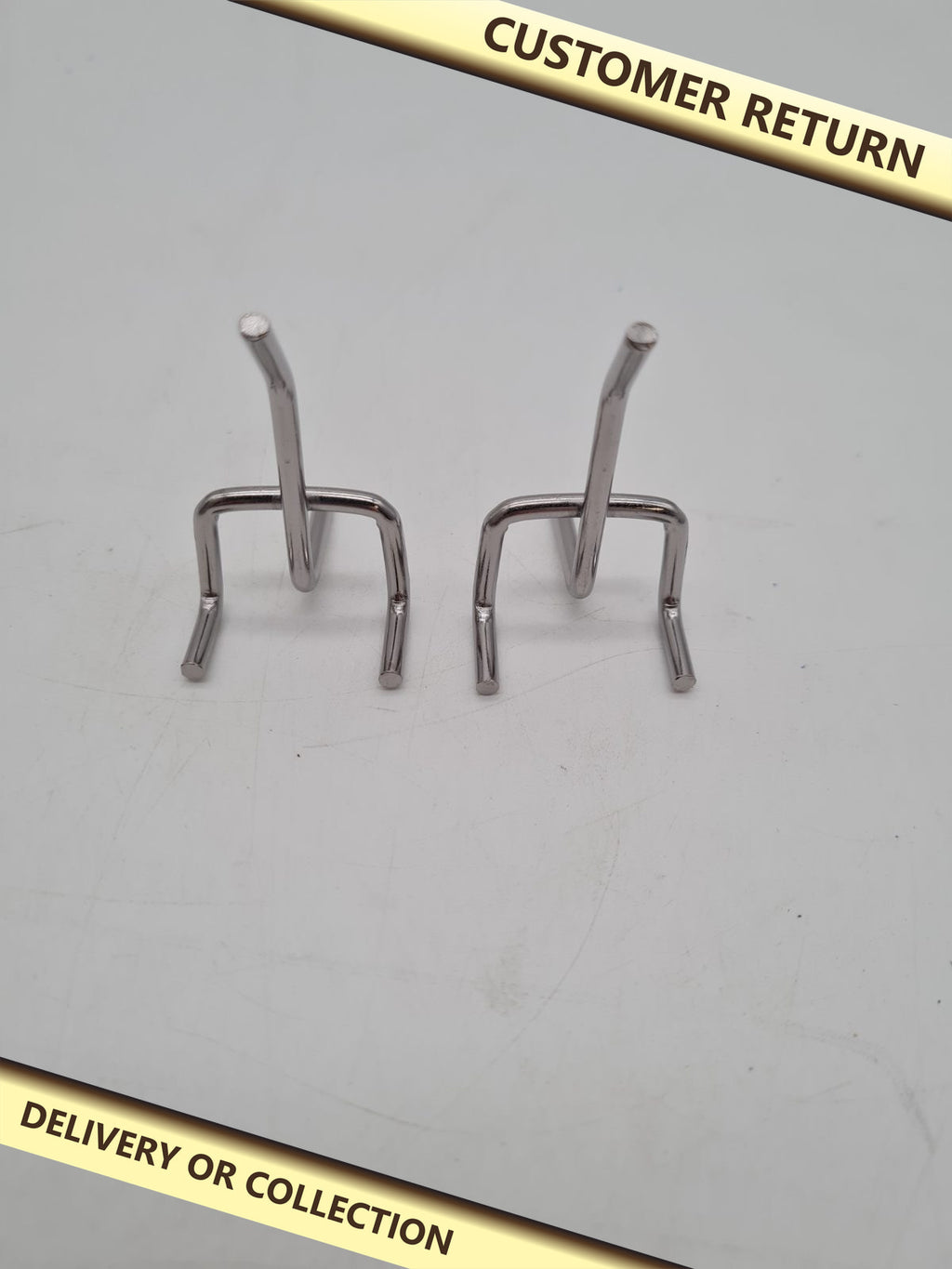 Pegboard J-Hook Display Hooks â€” photograph 1 — Customer return; auction delivery information shown on image
