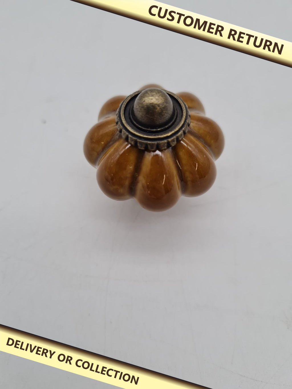 Pumpkin-Shaped Ceramic Cabinet Knob â€” photograph 1 — Customer return; auction delivery information shown on image
